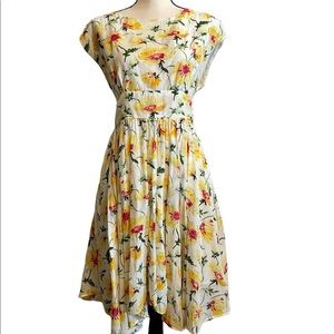 Anthropologie floral summer dress with cute back accent.